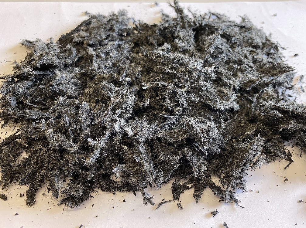 E-Cova rubber shreds with textile fibers